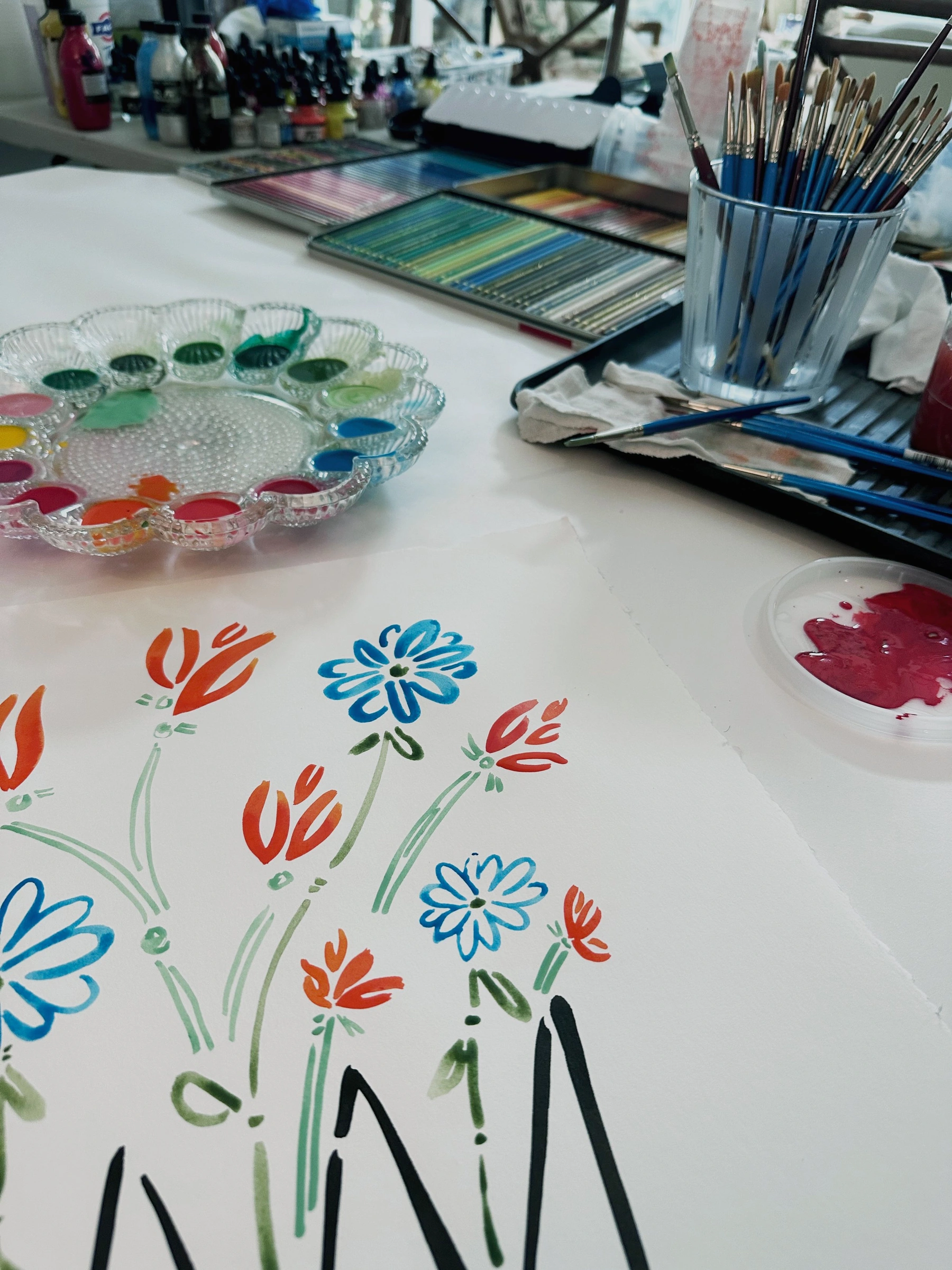 Floral paintings in Molly DiMeo’s studio